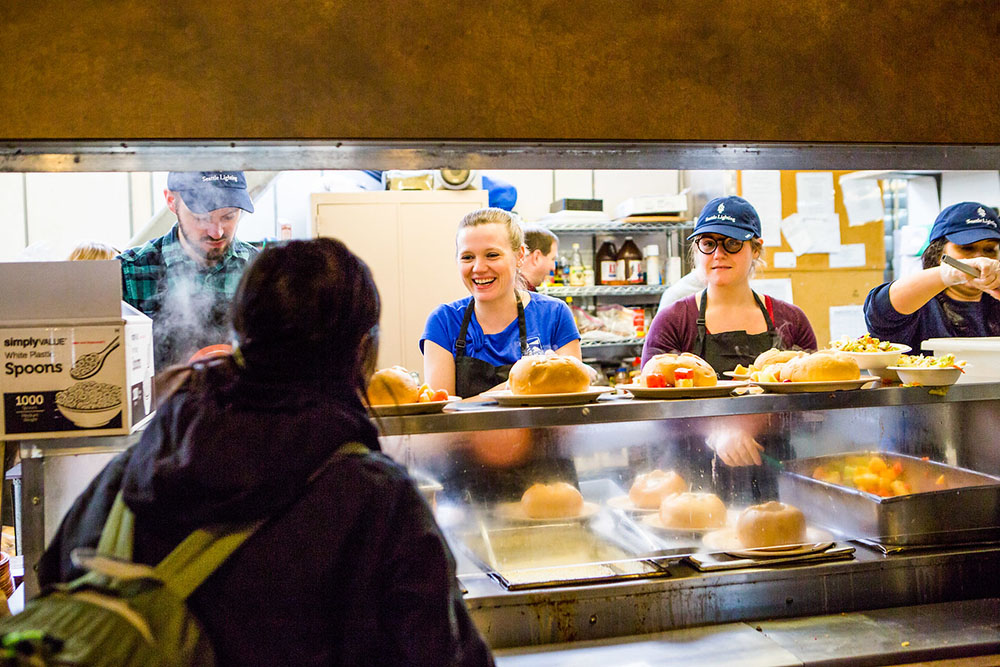 Volunteers serving chowder on National Chowder Day at Seattle's United Gospel Mission