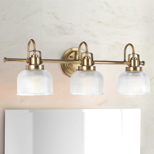 Archie Vintage Brass 3-Light Bathroom Light by Progress Lighting