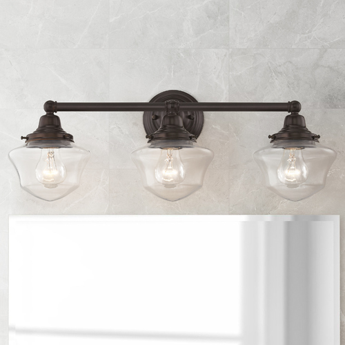 Clear Glass Schoolhouse Bathroom Light Bronze 3 Light 23.125 Inch Length